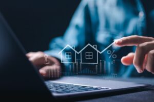 Real,Estate,Investment,,Businessman,Use,Laptop,With,House,Icon,For